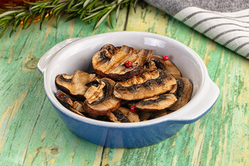 Tasty hot grilled champignon mushrooms