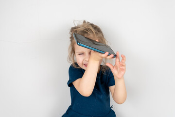 A little girl's frustration with a phone