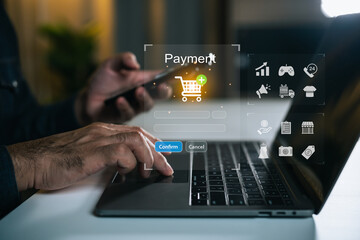 Person Using Laptop and Smartphone for Online Shopping with Payment Confirmation Process on a...