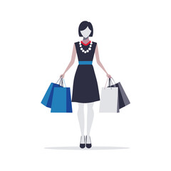 Obraz premium a woman in a trendy outfit carrying a designer shopping bag