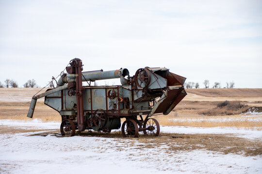 J. I. Case threshing machine in a snowy North Dakota field