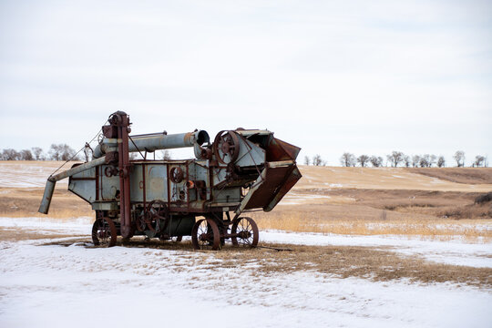J. I. Case threshing machine in a snowy North Dakota field