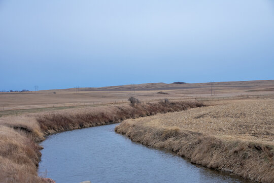 small creek cutting through the farm land