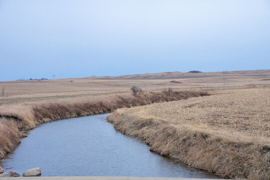 small creek cutting through the farm land