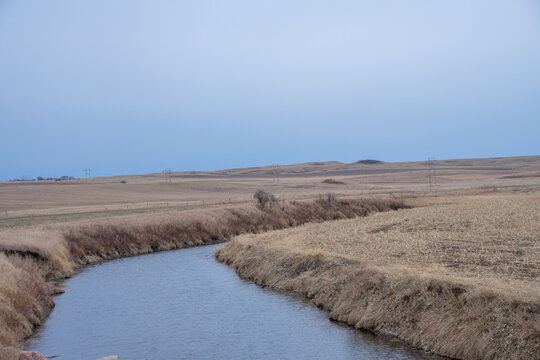 small creek cutting through the farm land