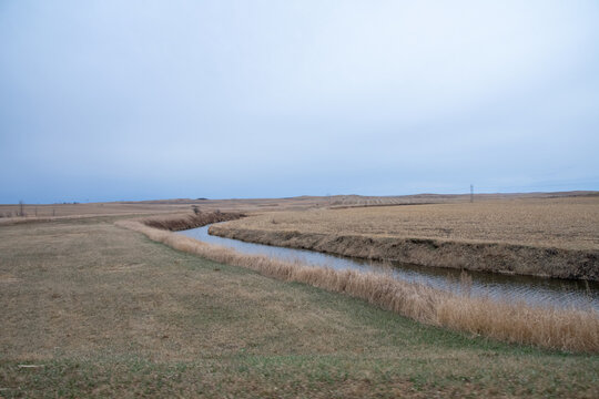 small creek cutting through the farm land