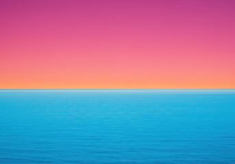 The calm ocean meets a colorful sky
