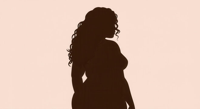 Silhouette of a curvy woman with beautiful flowing hair.