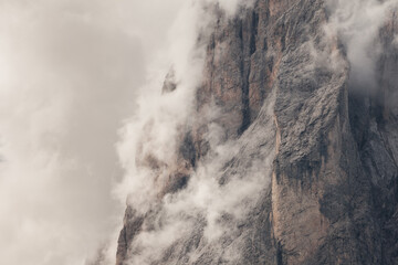 The northern side of Sasso Lungo among clouds from the Val Gardena area
