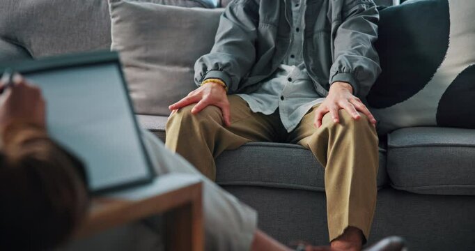 Hands, person and counseling with therapist on tablet for stress, trauma and mental health support. Nervous, patient and consultation with psychologist, checklist and symptom notes for medical help