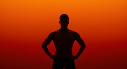Silhouette of Muscular Man Against Orange Background