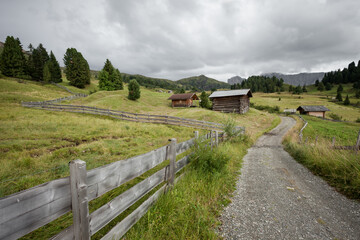 small house over a mountain pasture in Dolomites with wonderful panorama