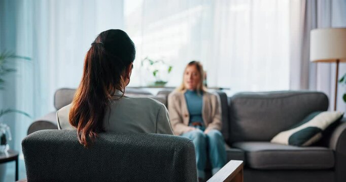 Meeting, therapy and back of psychologist in office for psychometric, evaluation and counseling. Mental health diagnosis, conversation and aptitude exam with people in clinic for support and client