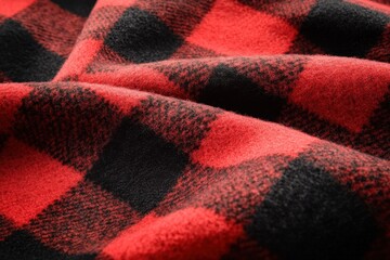 Close-up view of a red and black checkered fabric.