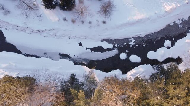 Frozen Creek Topdown Aerial View During Sunset in Quebec, Canada