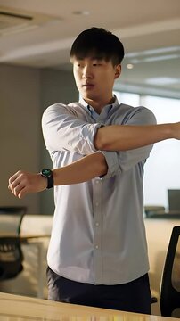 Energized office employee takes a quick stretch break at standing desk&mdash;prompted by a gentle reminder on smartwatch to boost circulation and relieve workplace tension.