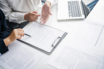 lawyer presenting legal contract and explaining litigation procedure to client in professional...