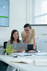 Business professionals developing roadmap toward carbon neutral energy with clean technology focus