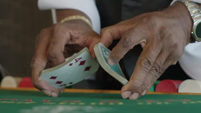 Blackjack dealer shuffling card deck