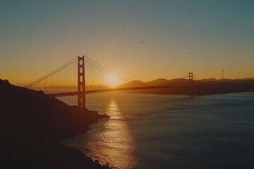 Obraz premium Sunrise timelapse over Golden Gate Bridge showcasing the morning light reflecting on the water, Sunrise time lapse of the Golden Gate Bridge