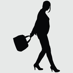 silhouette of a woman with a hand bag