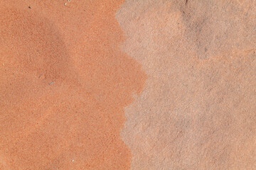 sand from red Aztec Sandstone outcrops, Early Jurassic geological formation of primarily eolian sand. Rainbow Vista Trailhead, Valley of Fire State Park, Clark County, Nevada geology. Weathering.