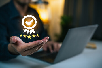 Person Holding Award Icon with Laptop in Background, Symbolizing Achievement, Success, and...