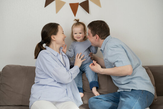 Family spending time together at home on the couch