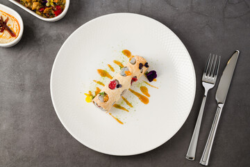 Rolled crispy crepe filled with seafood, herbs, and microgreens