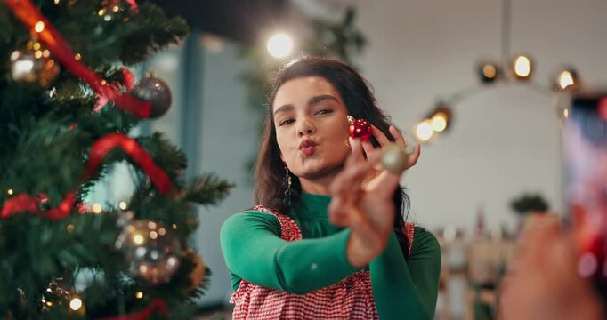 Picture, decorations and woman by christmas tree in home for playful memory or social media post. Goofy, photography and female person with baubles for camera at festive, celebration or xmas party.