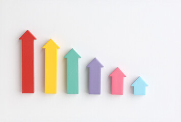 Multicoloured arrows pointing up and down. Symbolise growth progress, success in business finance....