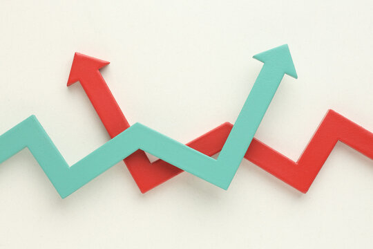 Multicoloured arrows pointing up and down. Symbolise growth progress, success in business finance. Rising bars of graphs represent market trends, return on investment, business development