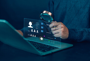 

Businessman using magnifying glass in job search network with human resource development concept...