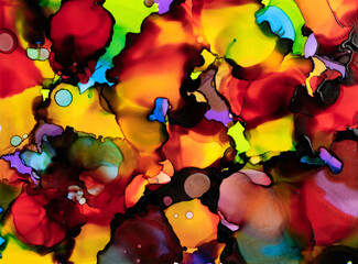 Colorful alcohol ink swirls form an abstract design