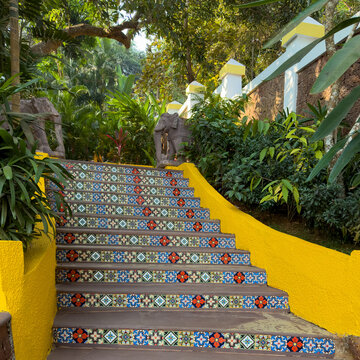 Enchanting Tropical Garden Staircase with Colorful Tile Art and Elephant Statues