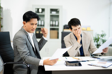 Frustrated manager scolds employee in office over financial error. Concept of workplace stress, reporting issues, conflict