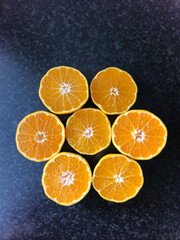 Orange halves on a grey kitchen counter