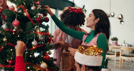 Christmas tree, decoration and people in office, help and bonding together with celebration. Group, friends and coworkers with Xmas, creative and holiday with break, vacation and event with ornaments - Powered by Adobe