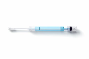 Fototapeta premium Syringe with blue liquid and needle placed on a white background