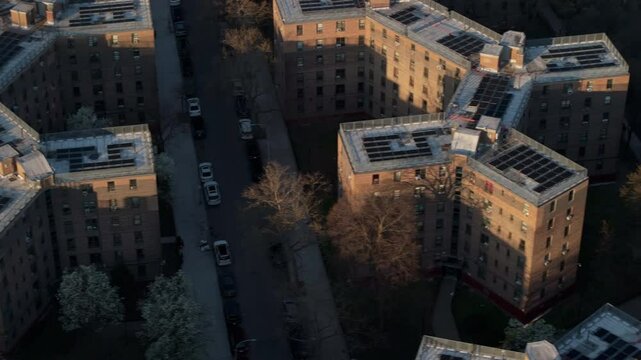 Aerial view of solar panels on public housing project buildings. Shot at sunrise in Queensbridge, Queens, New York City.