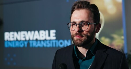 Speaker, seminar and man with microphone for sustainability with renewable energy transition. Male leader, convention or conference for learning of climate change, innovation or environment on screen