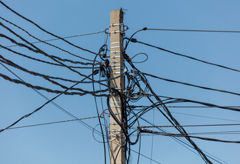 A pole with many wires coming out of it