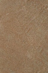 Earthy brown surface with grainy texture evoking a natural feel
