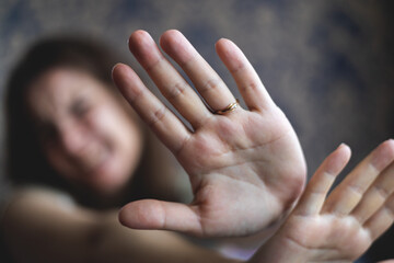 Woman shows negative gesture with her hand. Quitting bad habits concept