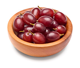 red grapes berries in wooden bowl isolated on white background. clipping path