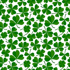 Shamrock or clover leaf flat design green seamless pattern falling leaves on white background vector illustration. Irish holiday celtic St Patrick day motif seamless pattern with shamrock clover leaf.