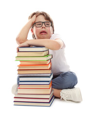 Upset boy with books on white background