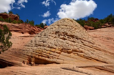 hiking the slick rock out to the man-made kanab sand caves along utah state highway 89. north of kanab, utah, on a sunny summer day