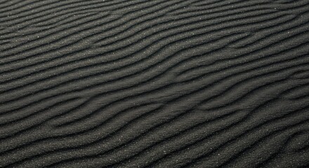 Black sand texture with wind patterns