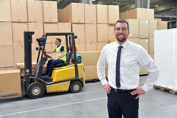  Worker and Manager in a warehouse in the logistics sector - transport and processing of orders in trade